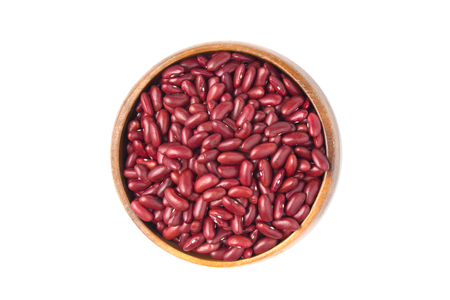 Top view of red beans in wooden bowl isolated on white background.の写真素材