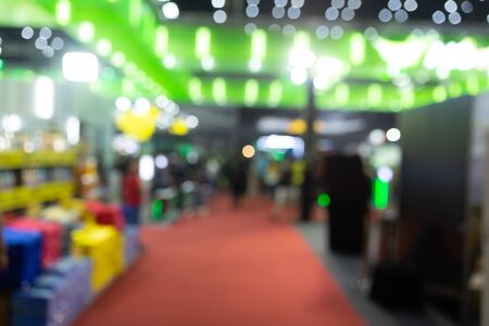 Abstract blur people in exhibition hall event computer game show festival background.