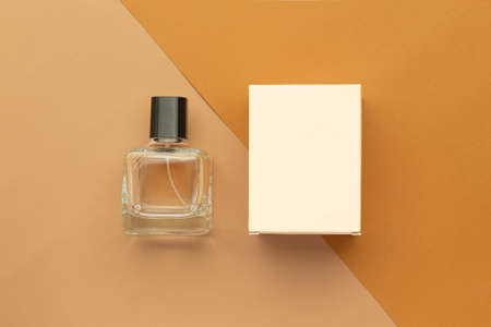 Perfume bottle and box mockup template on beige background.の写真素材