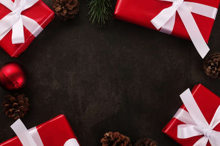 Top view of christmas decoration with gift boxes on grunge table border design, Christmas background with copy space.の写真素材