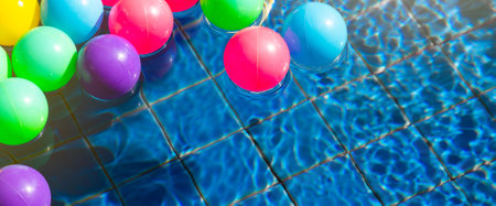 Colorful balls in swimming pool in the morning with copy space, Summer, vacation and relaxing...