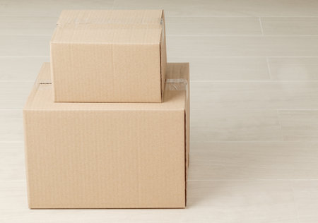 Stack of blank paper cardboard box mockup on the floor, Packaging template.