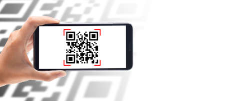 Hand using mobile smart phone scan Qr code on banner background. Barcode reader, Qr code payment,...