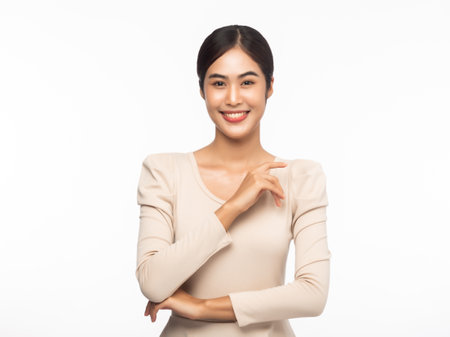 Portrait of young asian business woman looking at camera isolated on white background.の写真素材