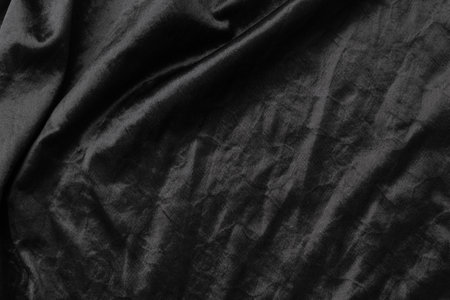 Abstract black fabric cloth texture background or liquid wave or wavy folds.の写真素材