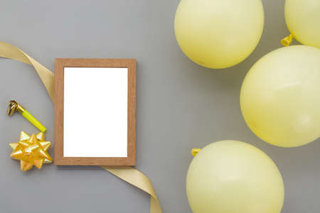 Happy birthday background, Flat lay party decoration with photo frame on pastel grey background.の写真素材