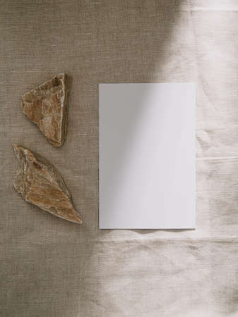 Invitation card mockup, blank greeting card template. Flat lay, Minimalist style.の写真素材