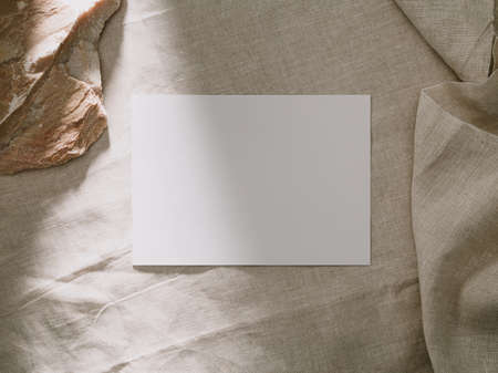 Invitation card mockup, blank greeting card template. Flat lay, Minimalist style.の写真素材
