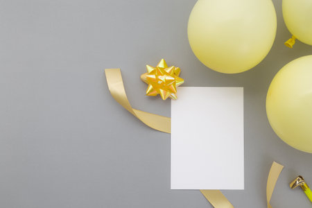 Happy birthday background, Flat lay party decoration with flyer invitation card on pastel grey background.の写真素材