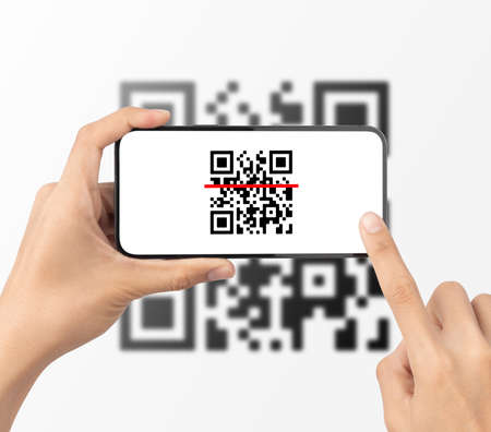 Hand using mobile smart phone scan Qr code. Barcode reader, Qr code payment, Cashless technology, Digital money concept.の写真素材