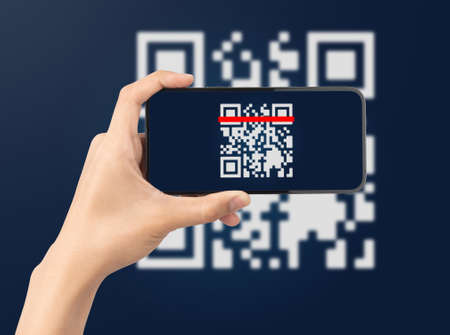 Hand using mobile smart phone scan Qr code. Barcode reader, Qr code payment, Cashless technology, Digital money concept.の写真素材