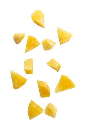 Falling pineapple slices isolated on white backgroundの写真素材
