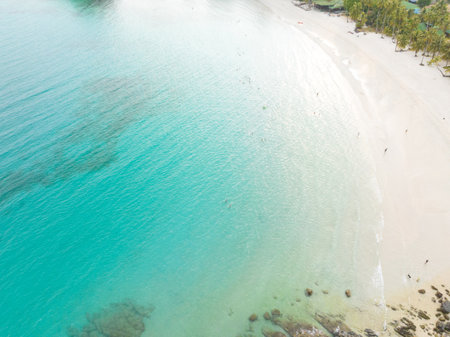Aerial drone view of beautiful beach with turquoise sea water and palm trees of Gulf of Thailand....
