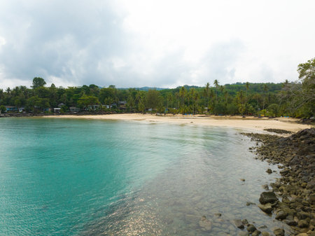 Aerial drone view of beautiful beach with turquoise sea water and palm trees of Gulf of Thailand. Kood island, Thailand.の写真素材