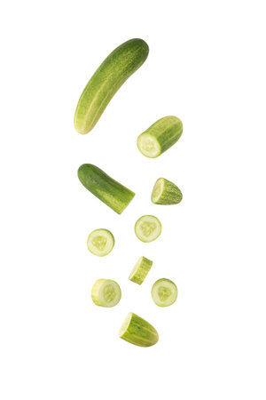 Falling Cucumber slice isolated on white background with clipping path.の写真素材