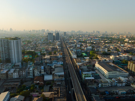 Aerial view of Bangkok downtown, Sky train railway, Cars on traffic road and buildings, Thailand.のeditorial素材