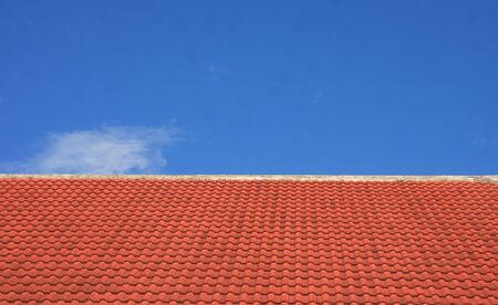 Roof tiles and blue skyの写真素材