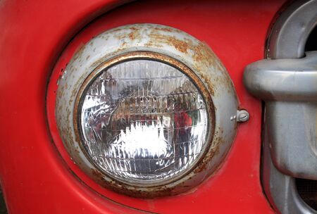 Detail of the front headlight of an old carの写真素材