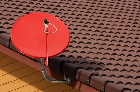 red satellite on roofの写真素材