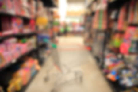 Blurred background of generic supermarket people walking shoppingの写真素材