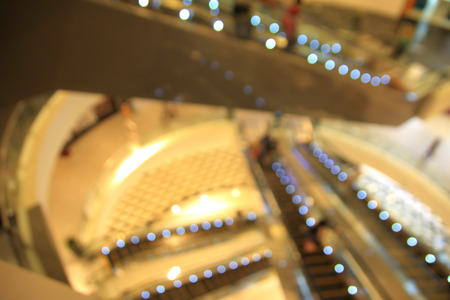 blurred photo of department store shopping mall center and people background