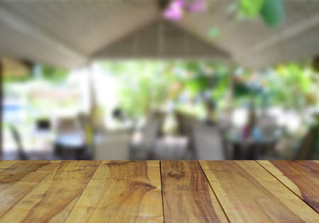 blurred image wood table and abstract coffee shop background