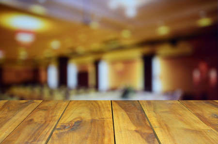 blurred image wood table and abstract Conference and Presentation. Audience at the conference hallの写真素材