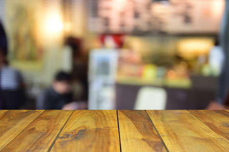 blurred image wood table and abstract coffee shop backgroundの写真素材