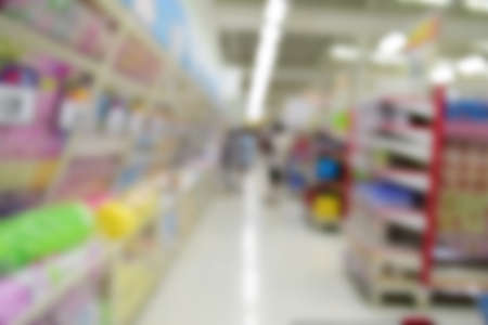 Blurred background of generic supermarket people walking shoppingの写真素材