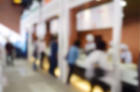 blurred image people in food center