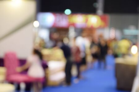 Blurred background of generic supermarket people walking shoppingの写真素材