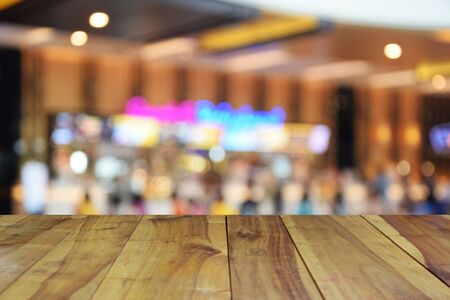 blurred image wood table and abstract theather ticket counter