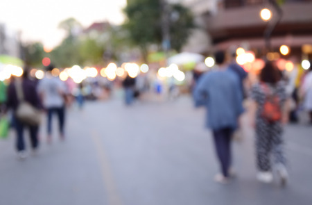 blurred image people walking street marketの写真素材