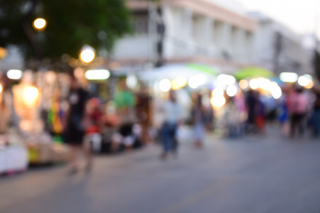 blurred image people walking street marketの写真素材