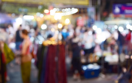 blurred image people walking street marketの写真素材