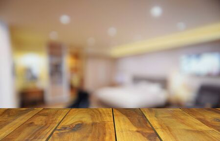 blurred image wood table and  bed room decoration