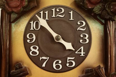 Close up of an old clock face