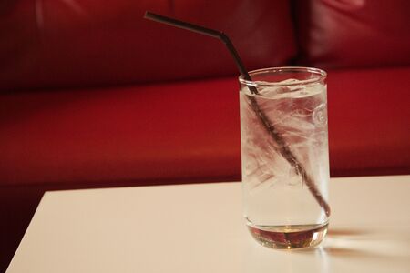 clean drinking water in glass on a wooden tableの写真素材