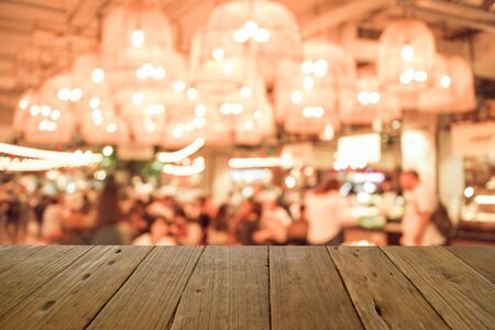 blur image wood table on food court background