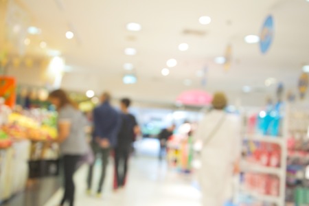 blurred image people in shopping mall with bokeh