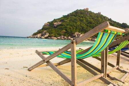 chair on beautiful tropical beach with white sand and turquoise water, perfect vacation