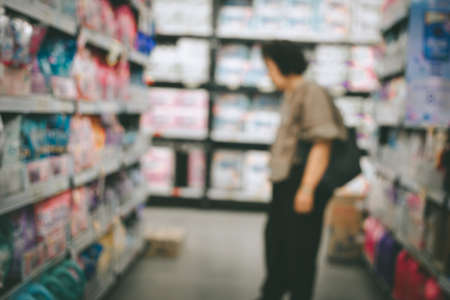 Blurred image  abstract people shopping in supermarket interior for backgroundの写真素材