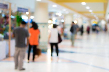 blurred image people in shopping mall with bokehの写真素材
