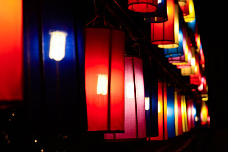 colourful fabric lanterns in the nightの写真素材