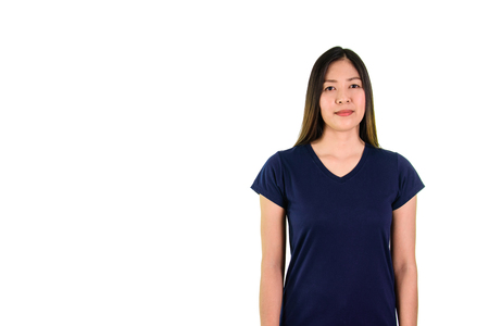 Asian young woman in blue shirt smiling and looking at the camera on white background.の写真素材
