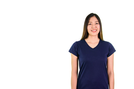 Asian young woman in blue shirt smiling and looking at the camera on white background.の写真素材
