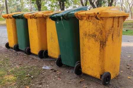 green yellow trash in the parkの写真素材