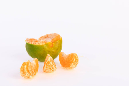 tangerine peel species of green yellow-orange color when cooked in sweetened juice chilled drink healthy vitamin C prevent colds feverの写真素材