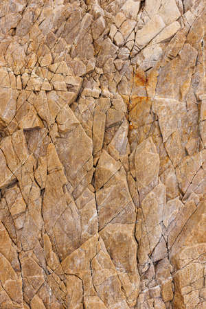 cliff rock stone details textures and patterns on white backgroundの写真素材