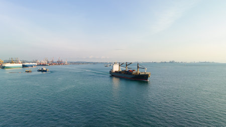 cargo logistic container ship carrying to import export goods and distributing product to dealer and consumers across worldwide, by container ship Transportation in open seaのeditorial素材